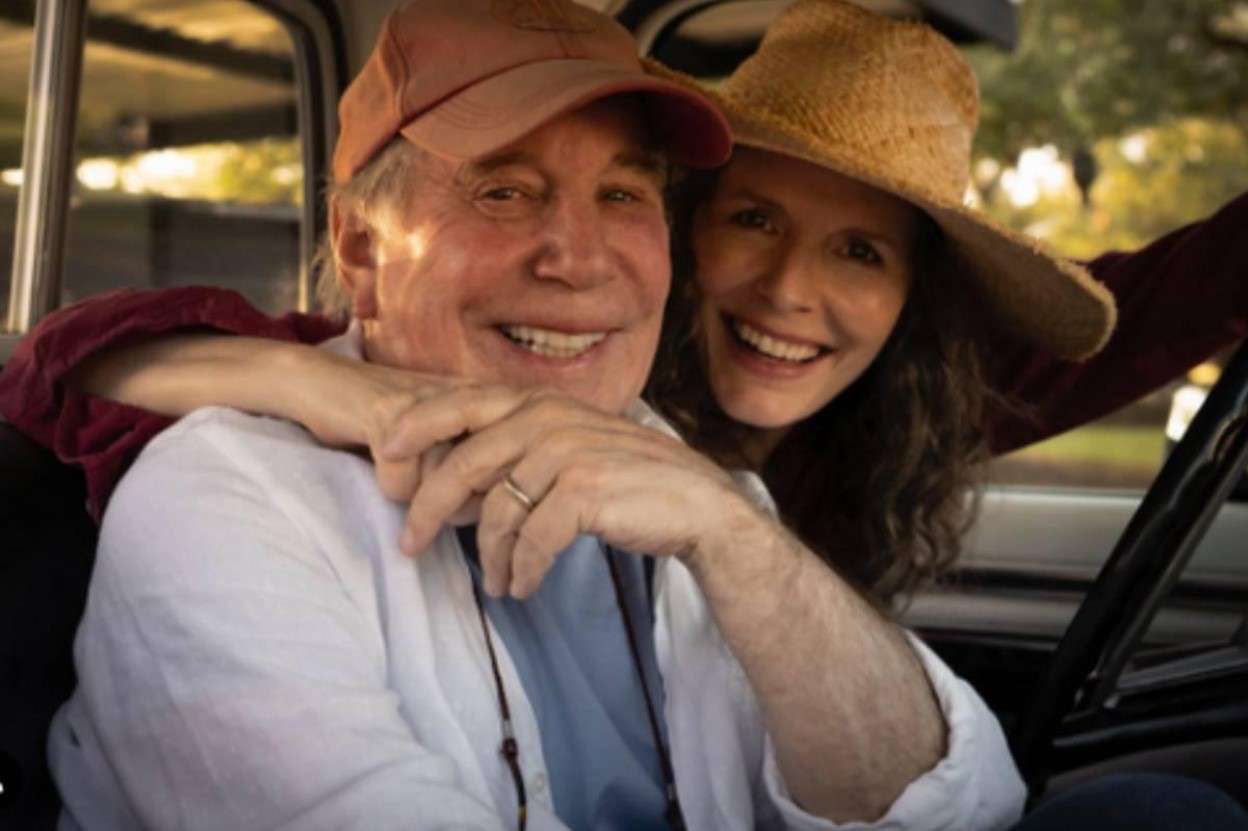 Paul Simon and His Wife Smiling in Car