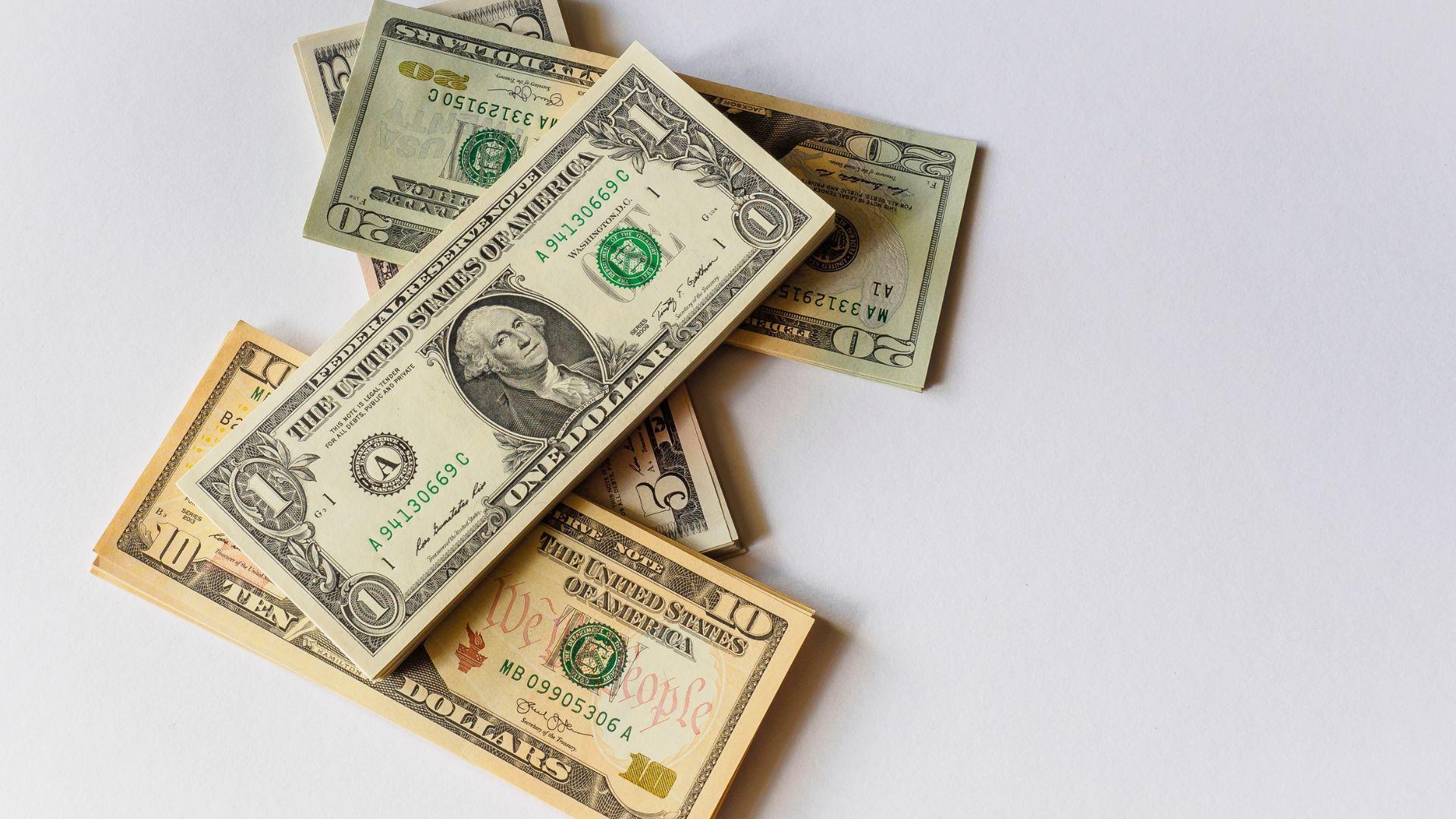 U.S. bank notes on a white table