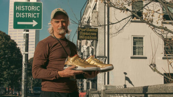 James Free poses with the ultra rare Nikes outside the Portland Rescue Mission