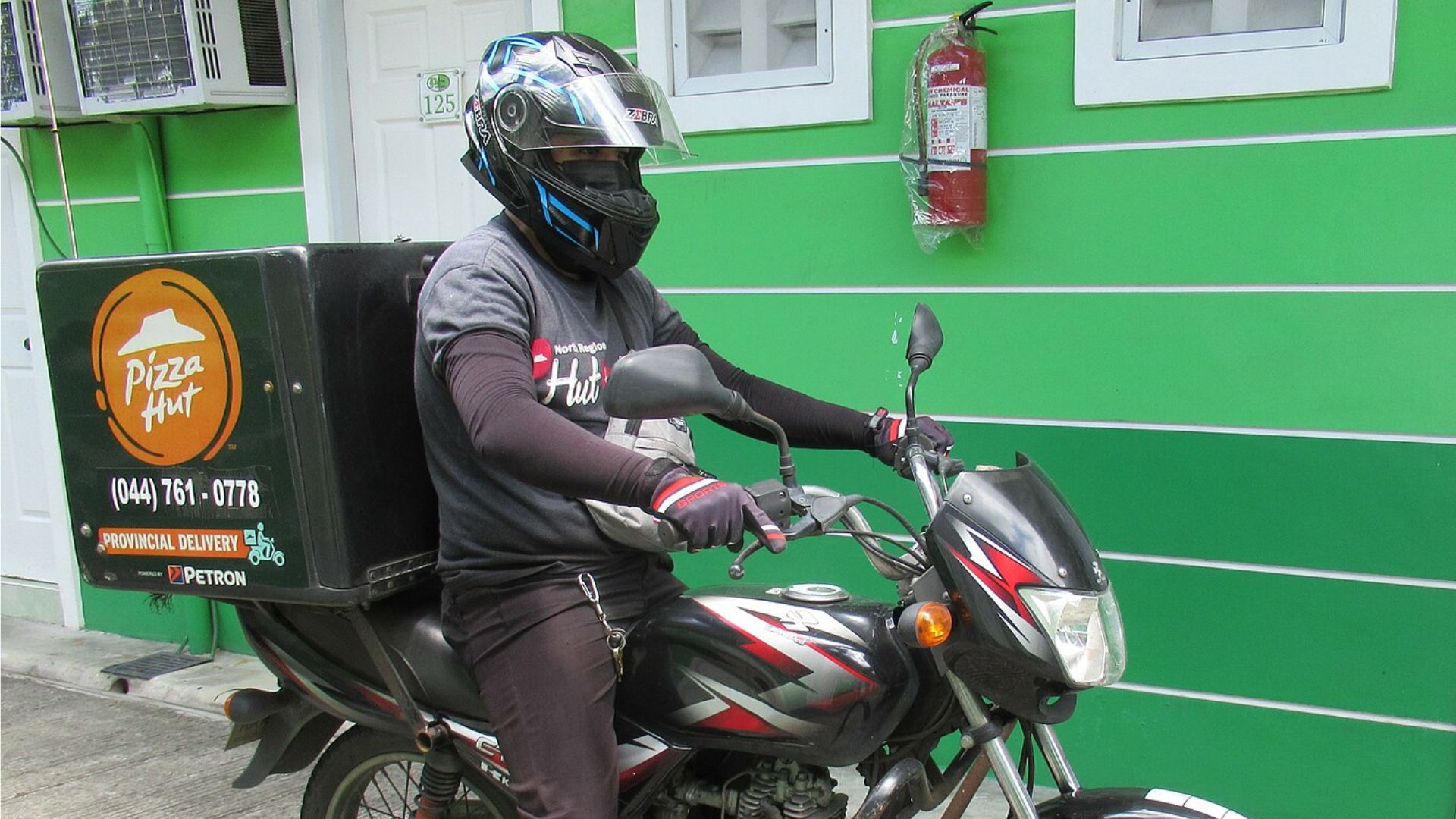 Pizza Hut Delivery Driver on Motorcycle