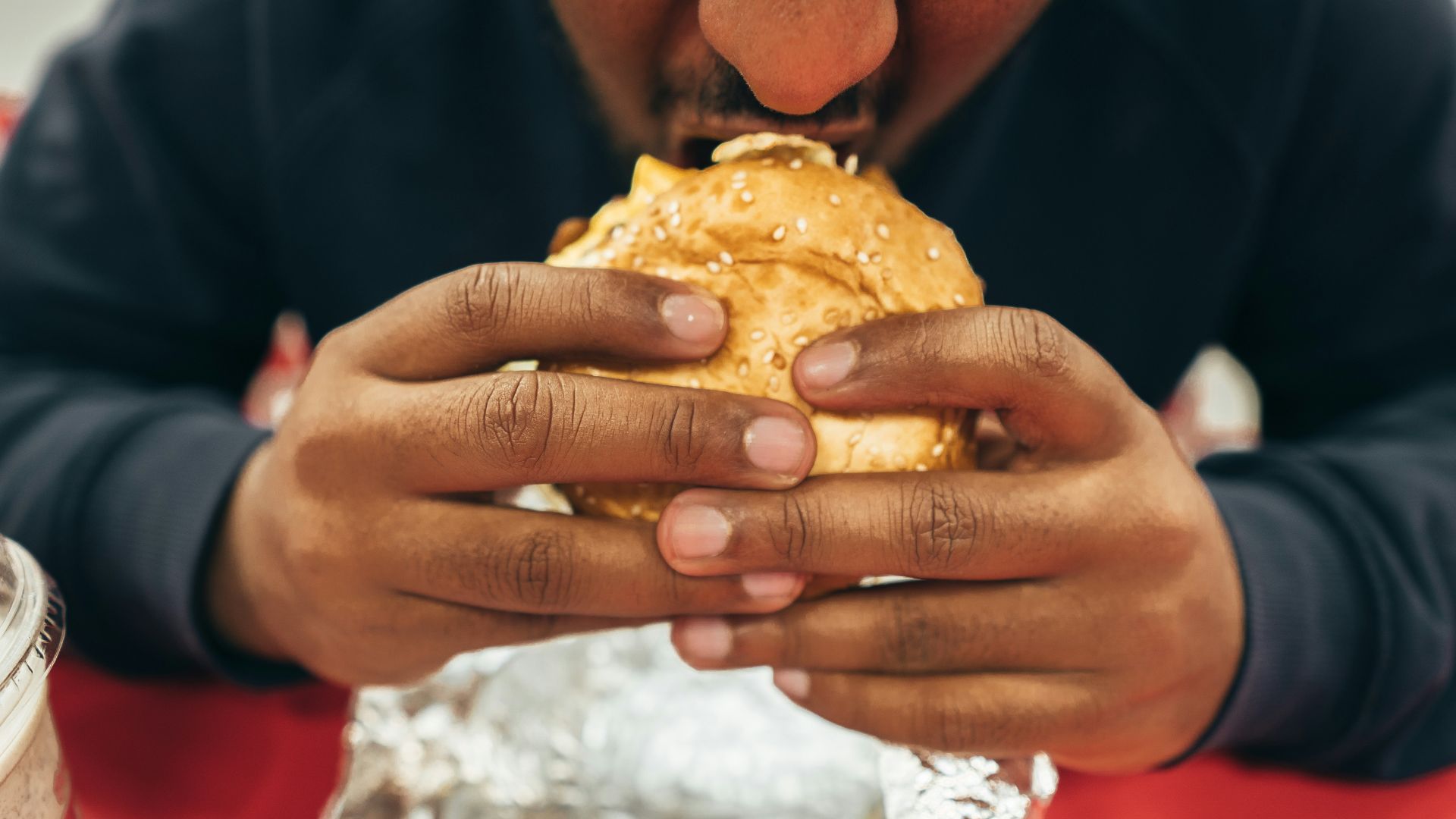 Man Eating Burger