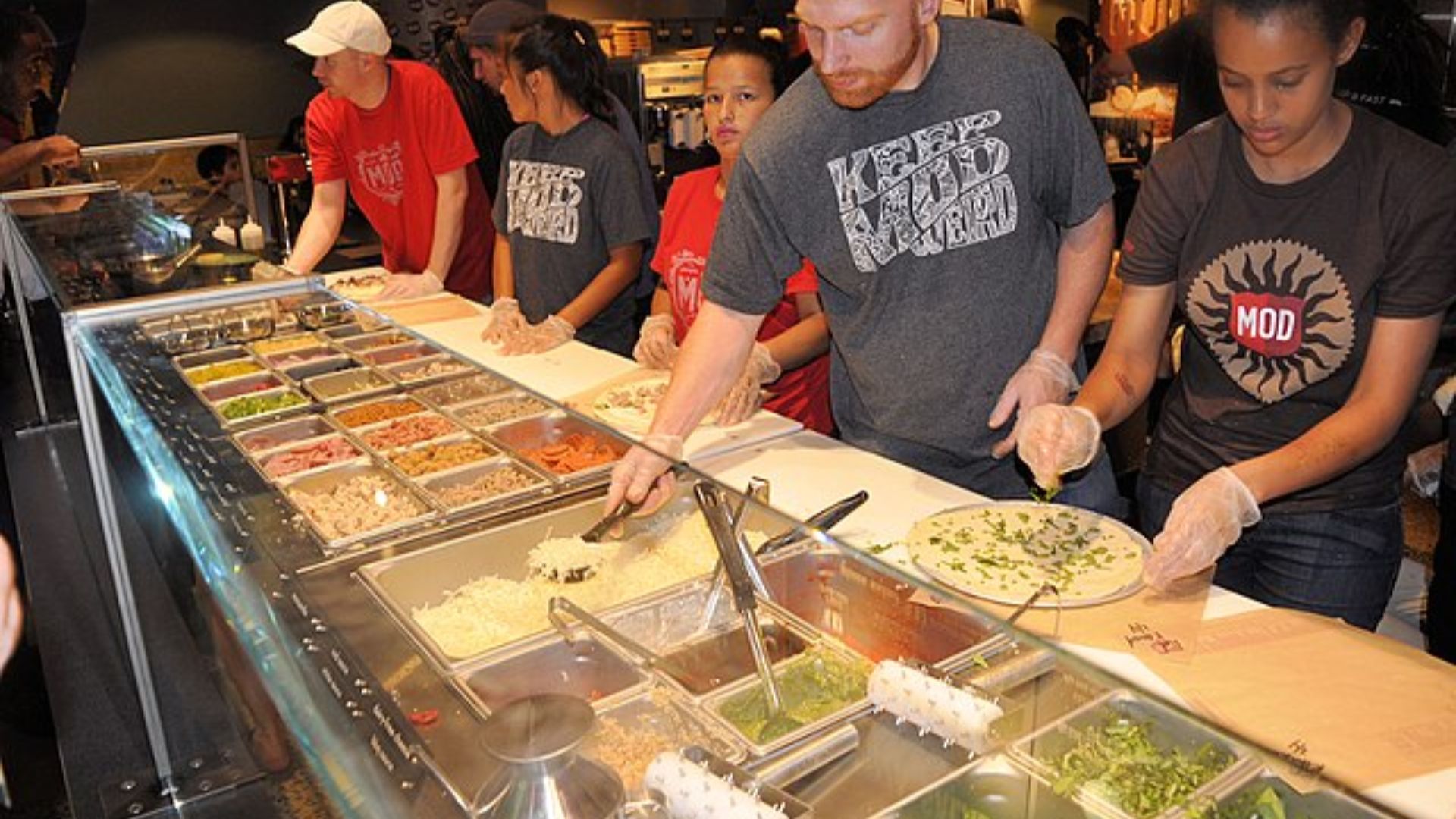 Mod Pizza Employees Working at Pizza Counter