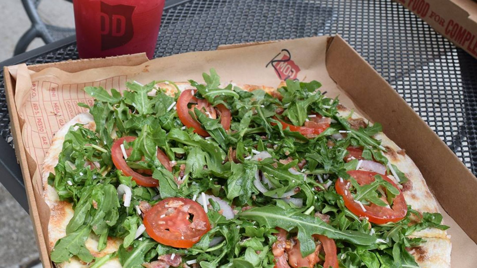 Mod Pizza With Lettuce and Tomato Toppings