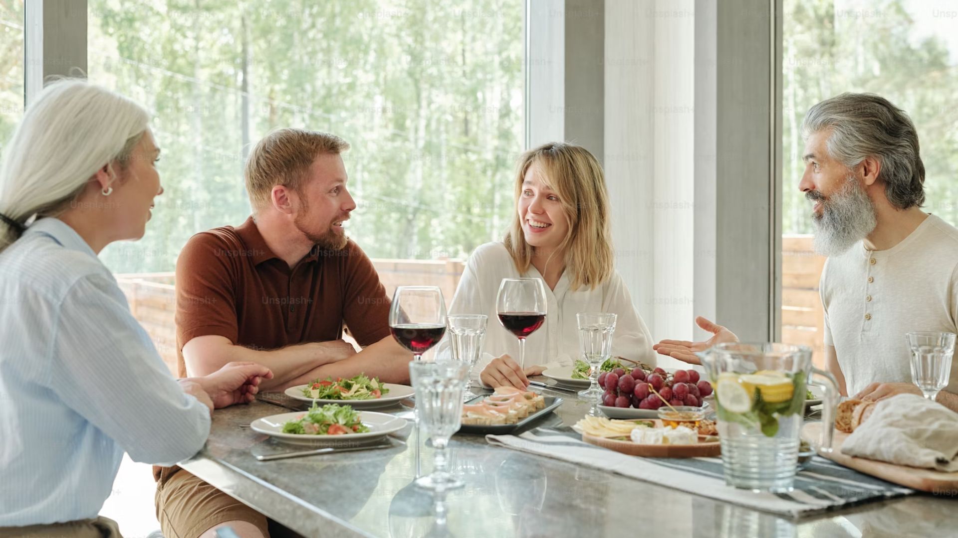 Two Couples Enjoying Dinner and Wine at Home