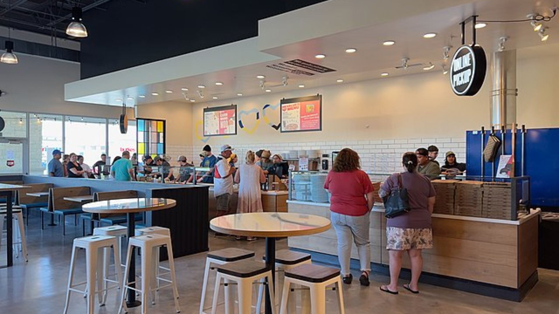 Customers Ordering Food at Mod Pizza Restaurant